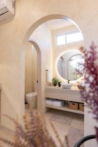 a bathroom with a sink and a mirror at Presidential Studio with Gated Parking at Casas Sanblu in Ensenada