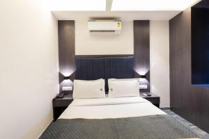 Postel nebo postele na pokoji v ubytování O Rooms Near Mumbai international Airport