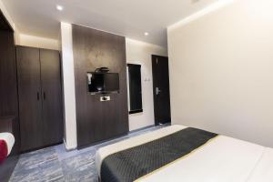 Postel nebo postele na pokoji v ubytování O Rooms Near Mumbai international Airport
