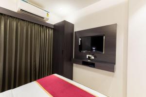 Postel nebo postele na pokoji v ubytování O Rooms Near Mumbai international Airport