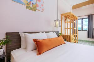 Postel nebo postele na pokoji v ubytování Homeland Villa Hoi An