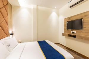 TV a/nebo společenská místnost v ubytování O Rooms Near Mumbai international Airport + 18 fotografií