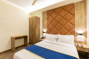 Postel nebo postele na pokoji v ubytování O Rooms Near Mumbai international Airport