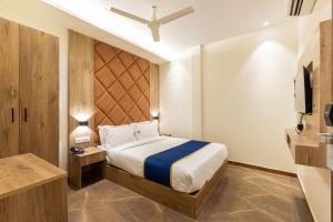 Postel nebo postele na pokoji v ubytování O Rooms Near Mumbai international Airport