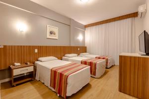 Postel nebo postele na pokoji v ubytování Hotel Pires