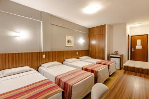 Postel nebo postele na pokoji v ubytování Hotel Pires