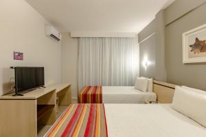 Postel nebo postele na pokoji v ubytování Hotel Pires