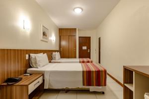 Postel nebo postele na pokoji v ubytování Hotel Pires