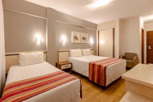 Postel nebo postele na pokoji v ubytování Hotel Pires
