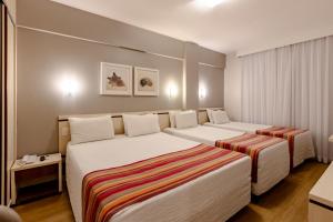 Postel nebo postele na pokoji v ubytování Hotel Pires