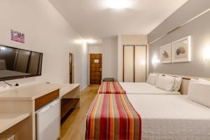 Postel nebo postele na pokoji v ubytování Hotel Pires