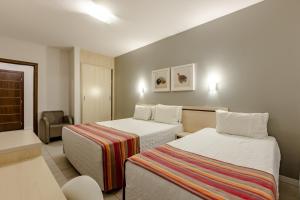 Postel nebo postele na pokoji v ubytování Hotel Pires
