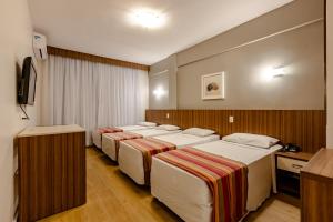 Postel nebo postele na pokoji v ubytování Hotel Pires