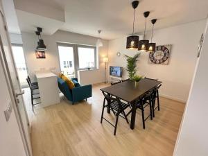 a living room with a table and a dining room at HEART OF THE CITY 10 ! in Porto
