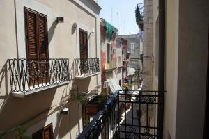 a view of an alley with balconies and plants at Dei Meravigli in Bari