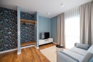 TV a/nebo společenská místnost v ubytování B85 Suites