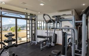 a gym with tread machines and a large window at Blue Tree Towers Millenium Porto Alegre in Porto Alegre +151 photos