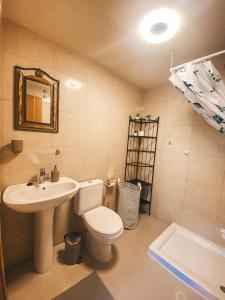 a bathroom with a toilet and a sink at Playa Maria Apartment 43 (Puerta al Cielo) in La Playa Calera