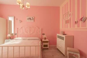 Postel nebo postele na pokoji v ubytování Hotel Albachiara