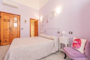 Postel nebo postele na pokoji v ubytování Hotel Albachiara