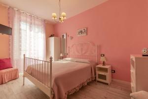 Postel nebo postele na pokoji v ubytování Hotel Albachiara