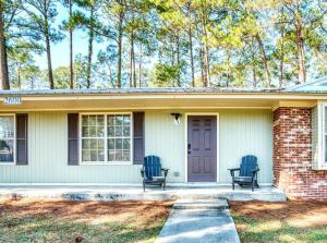 two blue chairs sitting on the porch of a house at Travel for work - Stylish 3 BDR - Southern Georgia in Moultrie