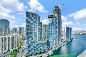 a view of a city with tall buildings and water at Amazing 2 Bedroom at Icon in the Heart of Brickell in Miami