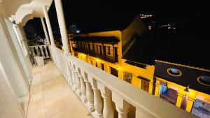 a view of a balcony of a building at night at Capitel Hostel in Cartagena de Indias