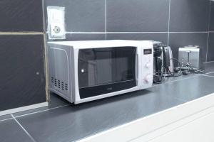 Kuchyň nebo kuchyňský kout v ubytování B & E Apartment