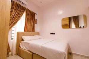Postel nebo postele na pokoji v ubytování Rhema Apartments