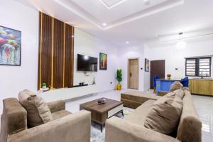 TV a/nebo společenská místnost v ubytování Rhema Apartments