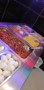 a buffet of food with eggs and other foods at فندق كلاسيك in Aqaba
