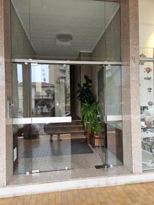 a large glass window in a building at Ama's house in Piacenza