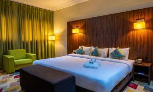 Alisa Hotel North Ridge客房内的一张或多张床位