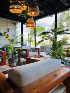 a living room with a couch and some plants at Villarit Porto in Gondomar