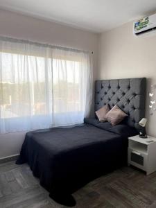 Postel nebo postele na pokoji v ubytování Hermosa casa familiar de fin de semana en Teques