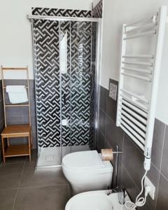 a bathroom with a toilet and a shower at B&B Ramerino in Grosseto