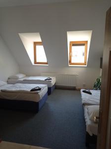 Кровать или кровати в номере Penzion Pralinka