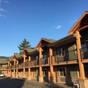 a row of apartment buildings with balconies at Vedder River Inn in Chilliwack