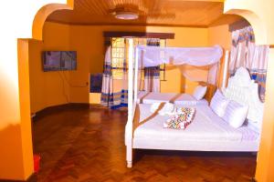 a childs bedroom with a bunk bed in a house at Consular Resort Meru in Meru