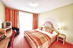 Ένα ή περισσότερα κρεβάτια σε δωμάτιο στο Gasthof Gutmann