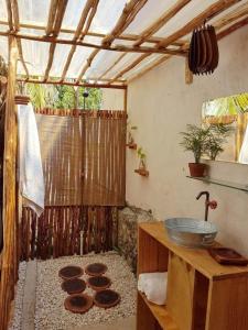 a bathroom with a shower with a sink and a counter at mountain view willcacocha lodge in Huaraz