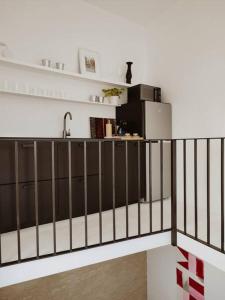 a kitchen with a counter and a sink at Antigua Casa Hermandad in Seville