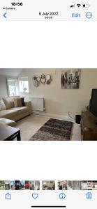 a living room with a couch and a tv at Kings head Inn in Stutton