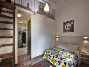 Posteľ alebo postele v izbe v ubytovaní B&B ai Condotti di Pisa da Filippo