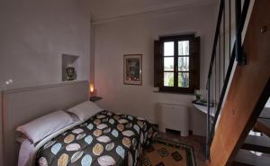 Posteľ alebo postele v izbe v ubytovaní B&B ai Condotti di Pisa da Filippo