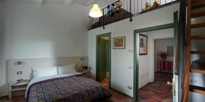 Posteľ alebo postele v izbe v ubytovaní B&B ai Condotti di Pisa da Filippo
