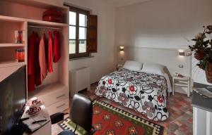 Posteľ alebo postele v izbe v ubytovaní B&B ai Condotti di Pisa da Filippo