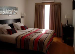 Ένα ή περισσότερα κρεβάτια σε δωμάτιο στο Hotel A Esteva +18 φωτογραφίες