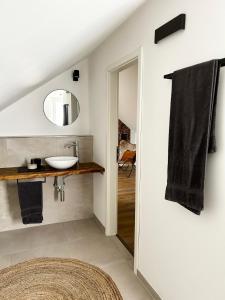 a bathroom with a sink and a mirror at Schickes Studio in bester Lage in Bad Salzuflen